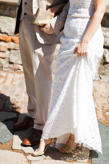 bride and groom details on dress