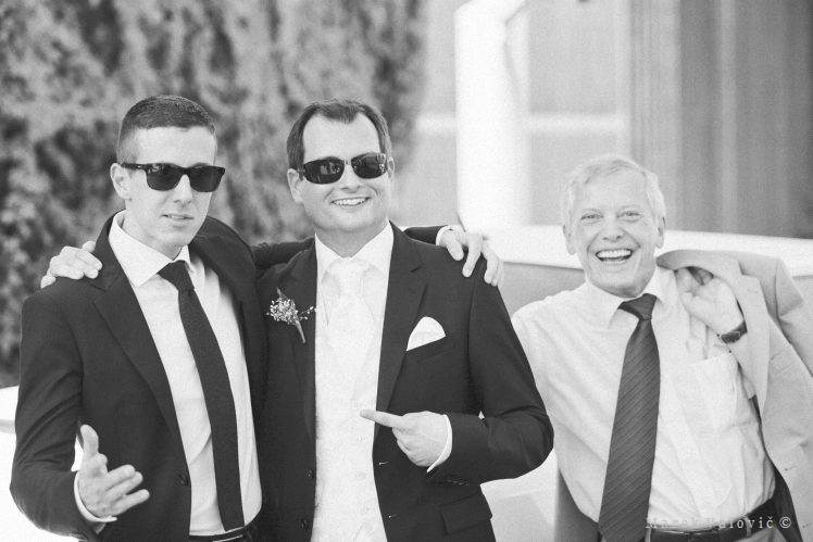 black and white wedding photography funny moment bestmen groom