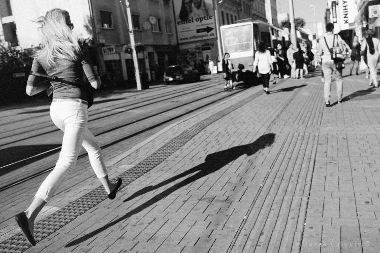 observational documentary reportage freelance photographer Bratislava running woman
