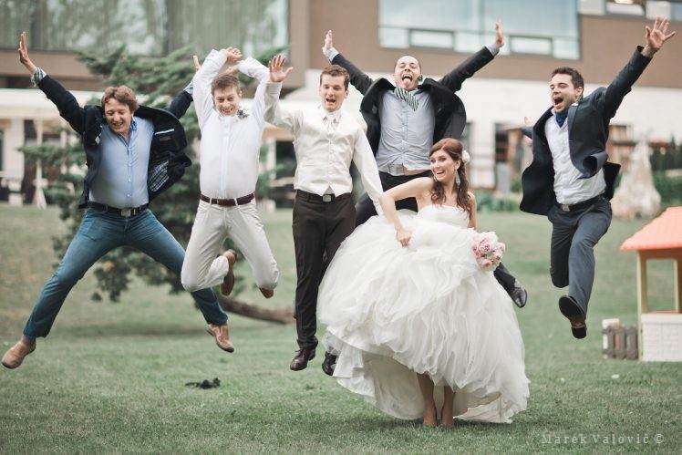 wedding group photo funny big jump