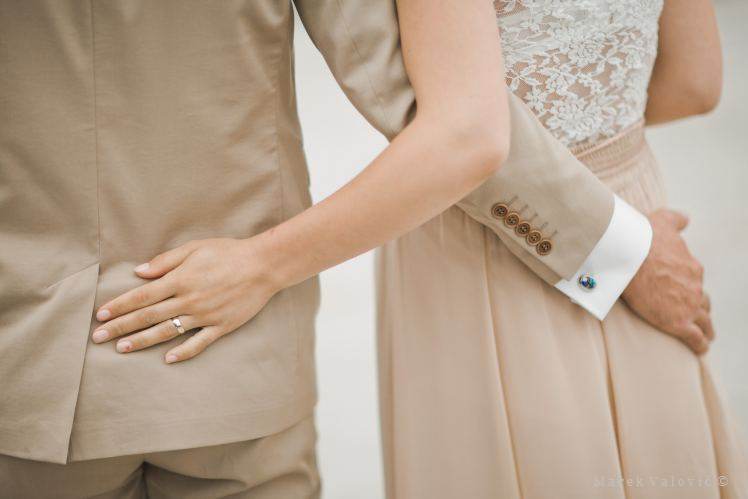 details - brode and groom in creamy dresses